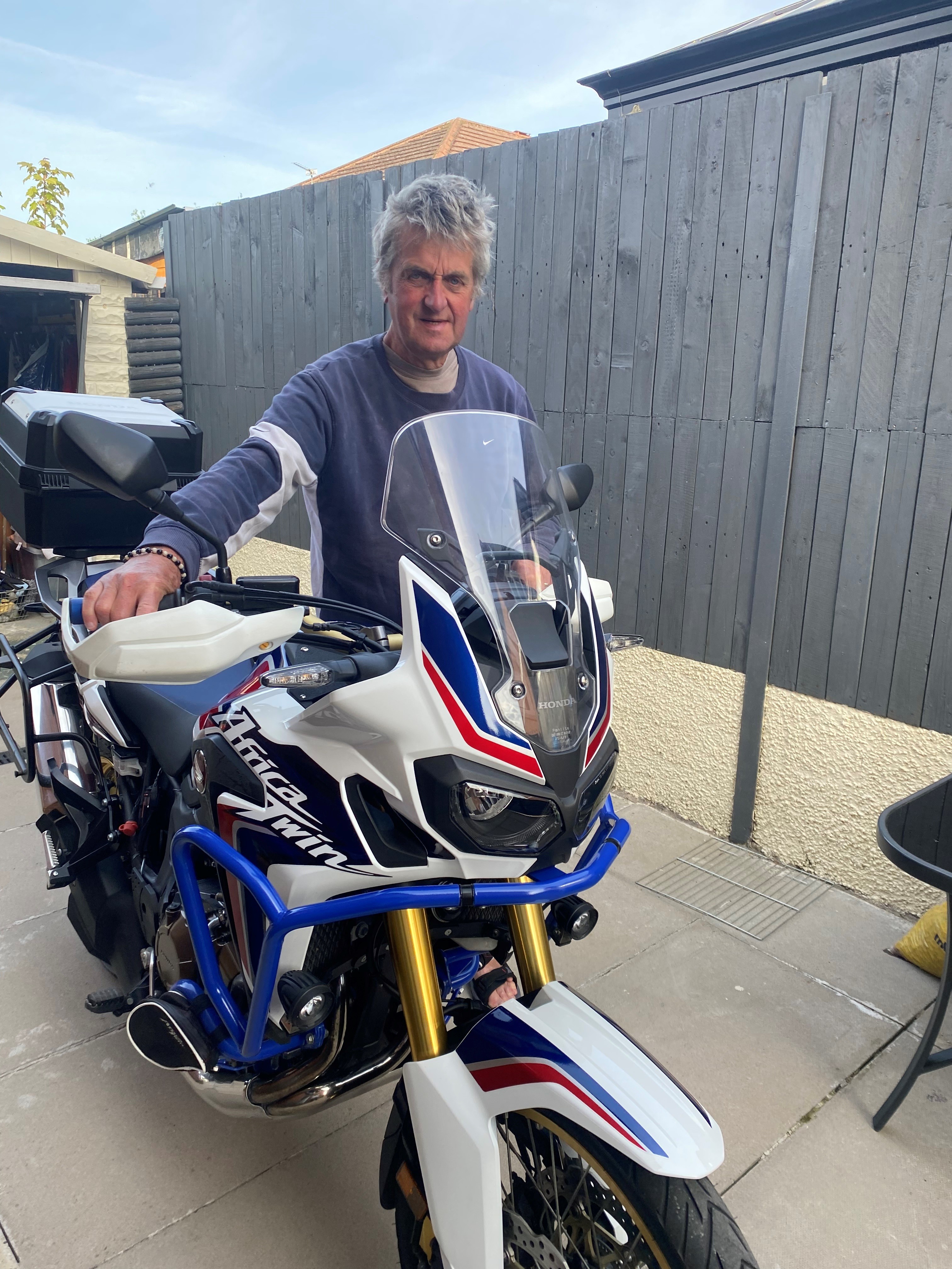 Andrew Cragg next to his motorbike