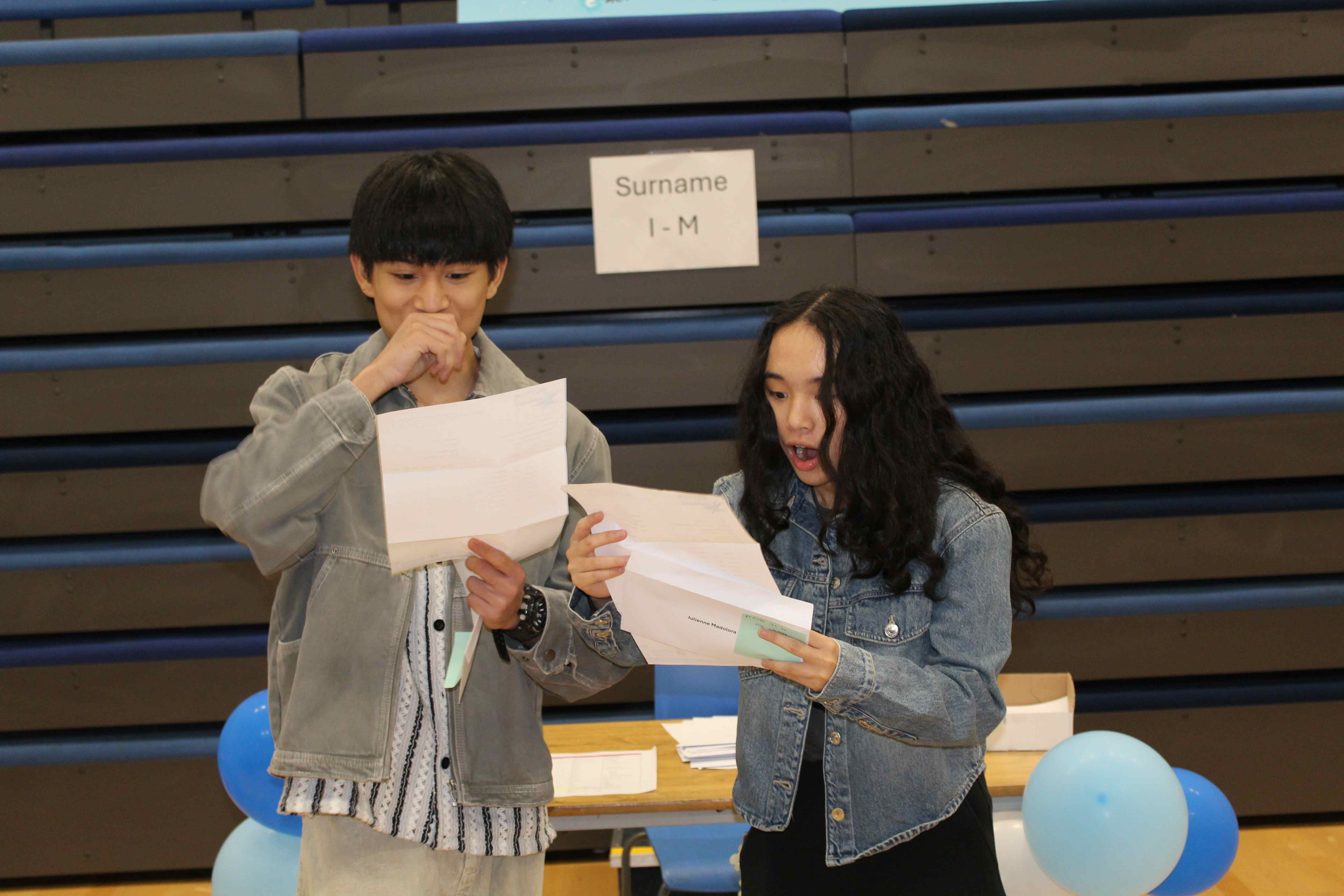 Two ecstatic E-ACT Royton & Crompton Academy students after opening their envelopes